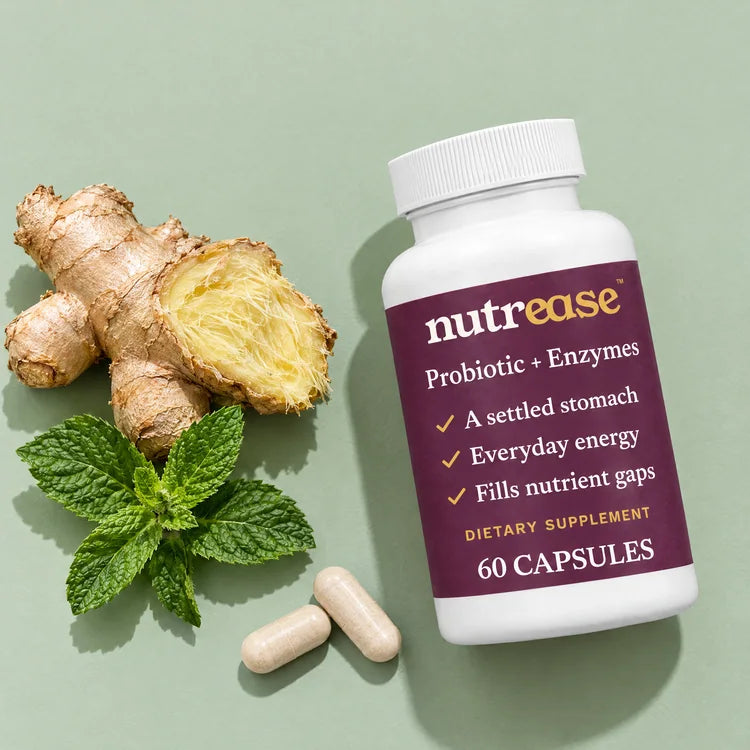 Fresh ginger root, peppermint leaves, two tan capsules and a Nutrease bottle